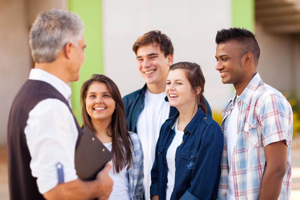 Teacher working with students